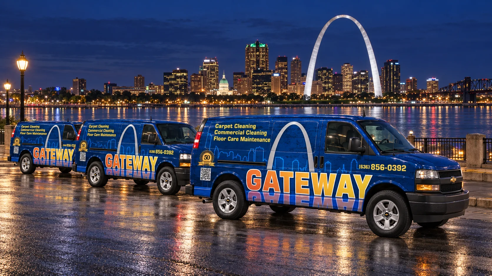 Gateway-branded cleaning vans beside the illuminated St. Louis skyline and Gateway Arch
